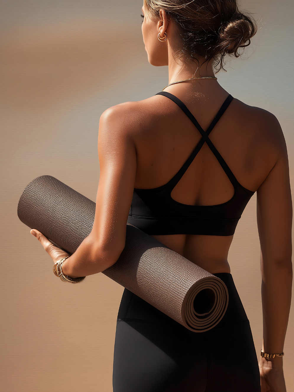 Woman carrying a workout mat